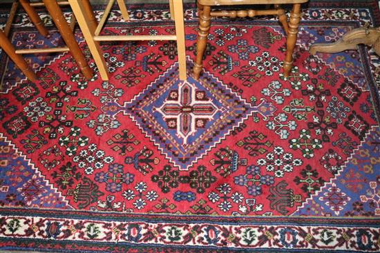 Persian red and blue ground rug